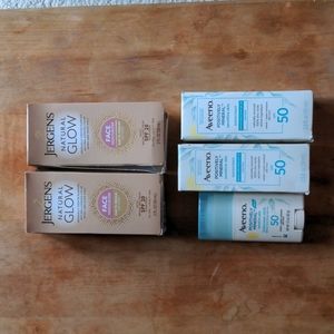 2 bottles Jergens natural glow face moisturizer , 2 bottles Aveeno sunscreen, 1